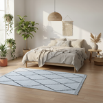 Modern bedroom with a bed, shag rug, and decorative plants