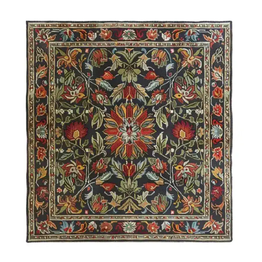 A beautifully intricate area rug, perfect for the living room, showcasing a traditional hand-tufted design with vibrant floral and foliage patterns. This large wool rug adds a touch of classic elegance to any living room space.