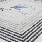 Close-up of a textured rug with geometric pattern