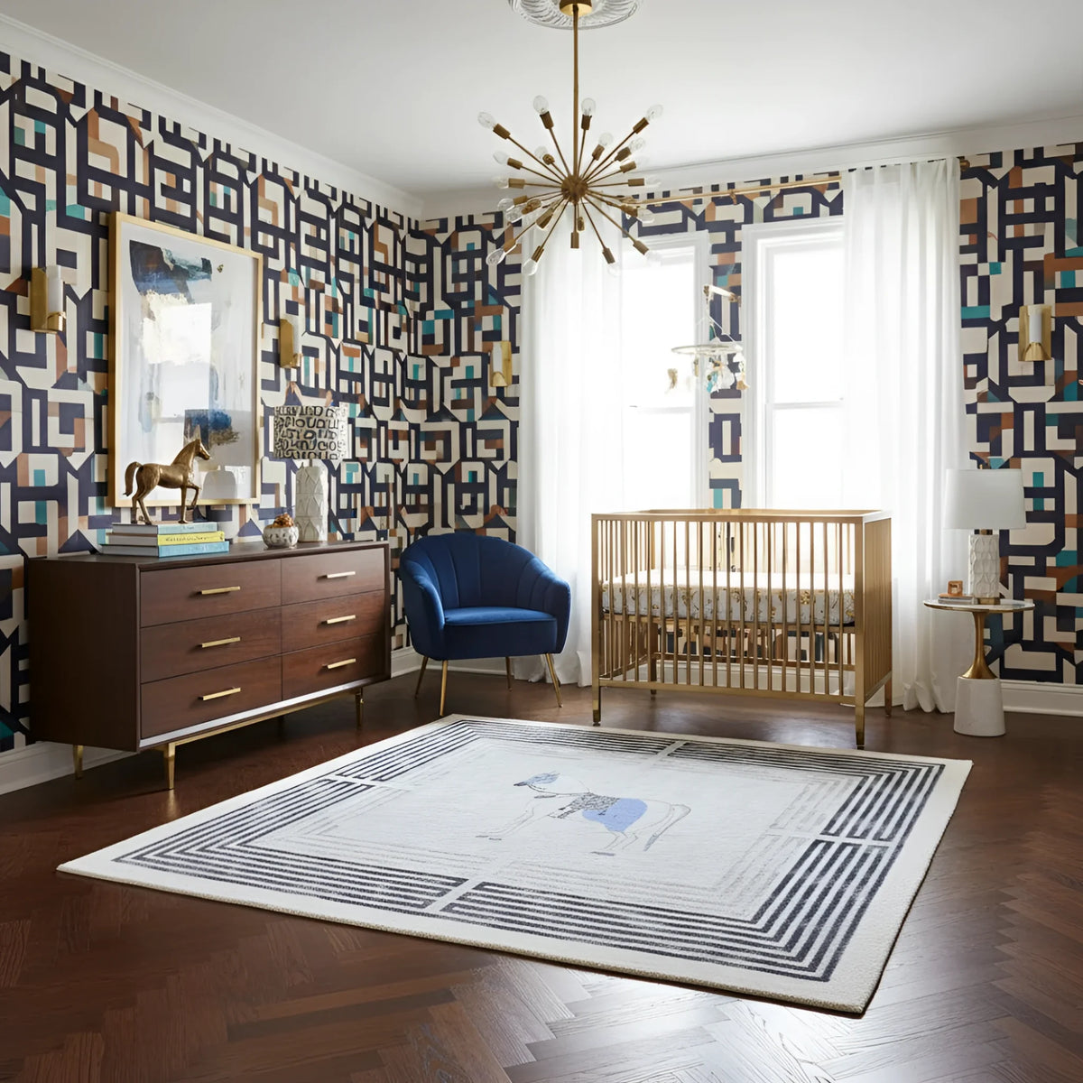 Nursery room with geometric wallpaper, blue chair, wooden crib, and decorative rug.