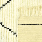 Close-up of a Classic Moroccan Hand Spun Wool Hand Knotted Area Rug, showcasing intricate black and ivory patterns ideal for living room area rugs. The detailed texture highlights the craftsmanship of this 8x10 living room rug.