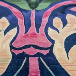 Close-up of the Serenade rug, pink blossom and cream leaves tufted on navy wool