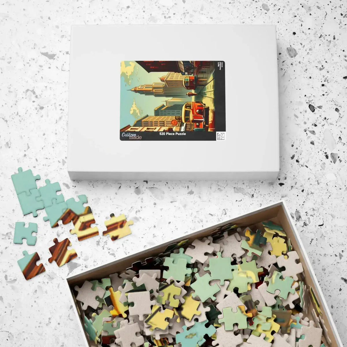Closed Historical City puzzle box with cityscape lid next to an open box brimming with pieces
