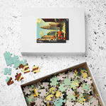 Closed Historical City puzzle box with cityscape lid next to an open box brimming with pieces