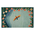 A beautifully crafted area rug featuring a vibrant bird in flight over a serene blue-green background. The edges are adorned with lush floral designs in shades of pink and orange, adding a touch of elegance and nature-inspired charm.
