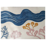 This image showcases the Coastal Calm Hand Tufted Wool Rug, featuring a serene wave pattern in rich blue tones and abstract coral designs in soft pink and mustard on a neutral background. The area rug presents a calming coastal theme, perfect for adding a touch of nature-inspired elegance to any room.