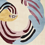 Stylish Coiled Chaos Pair Hand Tufted Area Rug featuring an abstract design with swirling patterns in shades of blue, burgundy, and beige. Perfect for adding a contemporary touch to large living rooms, this 8x10 wool rug blends art and comfort effortlessly.