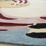 Close-up of a colorful rug with abstract patterns