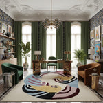 Decorative living room with a colorful rug, green chairs, and patterned walls.