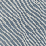 A striking hand-tufted area rug featuring a contemporary design with bold, wavy stripes in blue and white. This wool rug is perfect for adding a modern touch to your living room decor, ideal for an 8x10 space. The abstract pattern creates a sense of movement, making it a standout piece among area rugs for the living room.