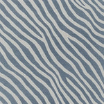 A striking hand-tufted area rug featuring a contemporary design with bold, wavy stripes in blue and white. This wool rug is perfect for adding a modern touch to your living room decor, ideal for an 8x10 space. The abstract pattern creates a sense of movement, making it a standout piece among area rugs for the living room.