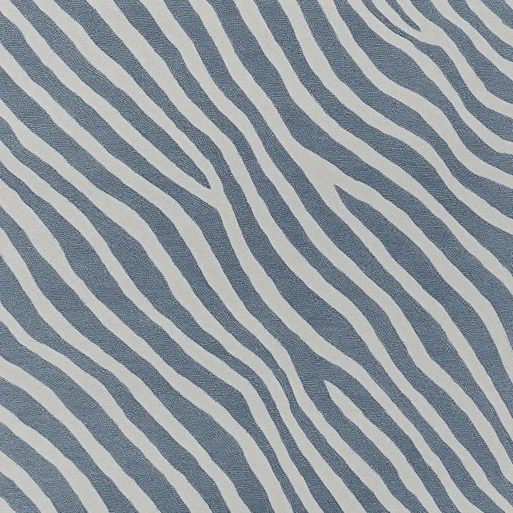 A striking hand-tufted area rug featuring a contemporary design with bold, wavy stripes in blue and white. This wool rug is perfect for adding a modern touch to your living room decor, ideal for an 8x10 space. The abstract pattern creates a sense of movement, making it a standout piece among area rugs for the living room.