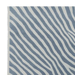 Stylish area rug featuring a contemporary zebra-like pattern with wavy blue and white stripes. Perfect for adding a modern touch to any living room, this 8x10 wool rug is a standout choice among area rugs for living rooms.