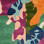 Top view of the Color Clash Canvas Hand Tufted Rug, showcasing a vibrant abstract design with bold colors like green, orange, and purple. This contemporary square area rug is perfect for large living rooms, adding a touch of modern art to your space. Made from high-quality wool, this 8x10 square rug is both stylish and durable.