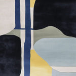 A contemporary area rug featuring an abstract geometric design with contrasting colors of blue, yellow, black, and grey. This wool rug is perfect for adding a modern touch to living rooms, especially in an 8x10 size. Ideal for those seeking stylish living room area rugs.