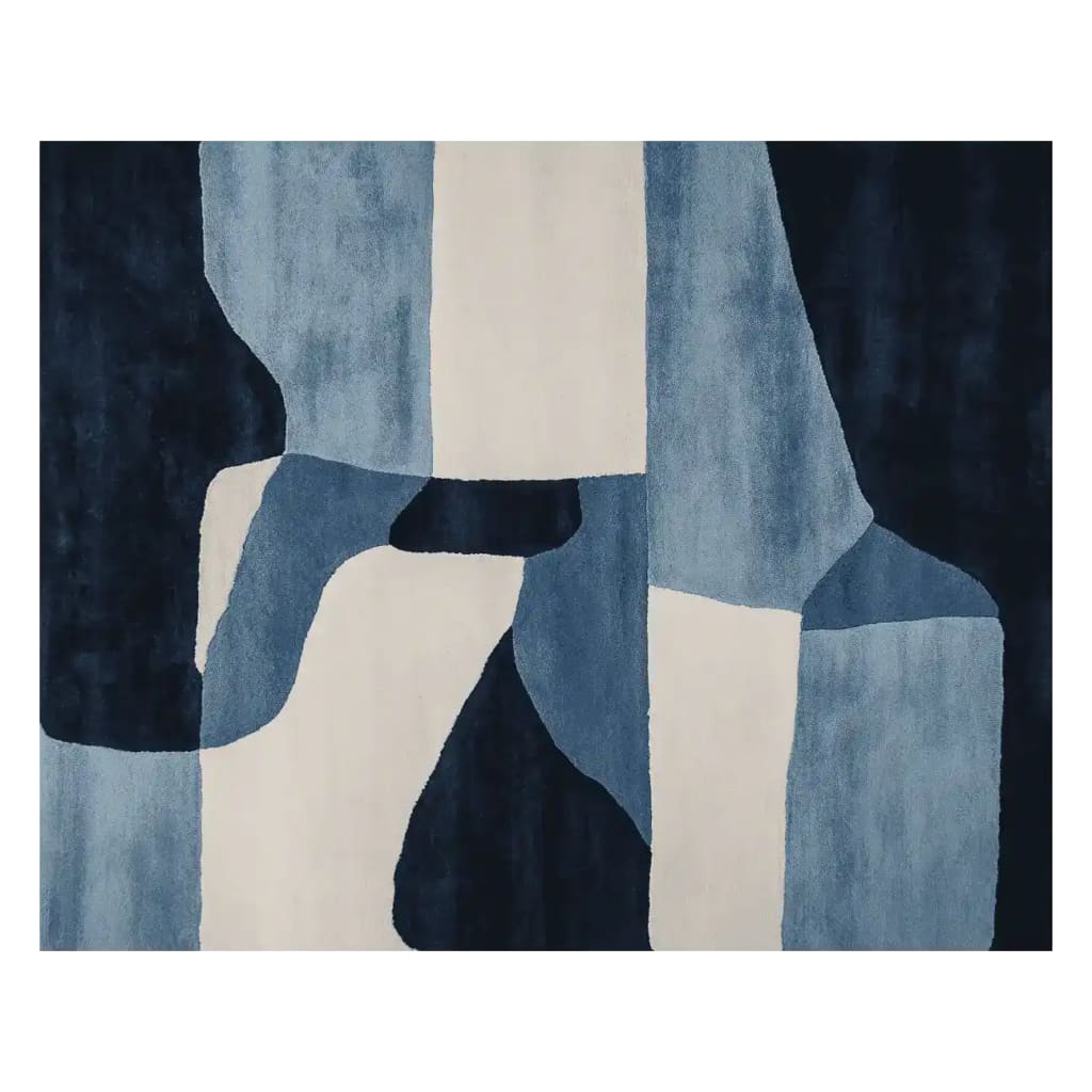 A stylish hand tufted area rug with an abstract design in shades of blue and white. This contemporary wool rug is perfect for adding a modern touch to any living room, showcasing a unique pattern that complements various decor styles.