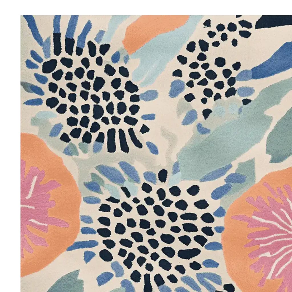A vibrant and contemporary area rug showcasing an abstract floral design in shades of blue, orange, and pink, ideal for large living room spaces. This wool rug adds a touch of modern elegance to any interior, perfect as an area rug for living room settings.