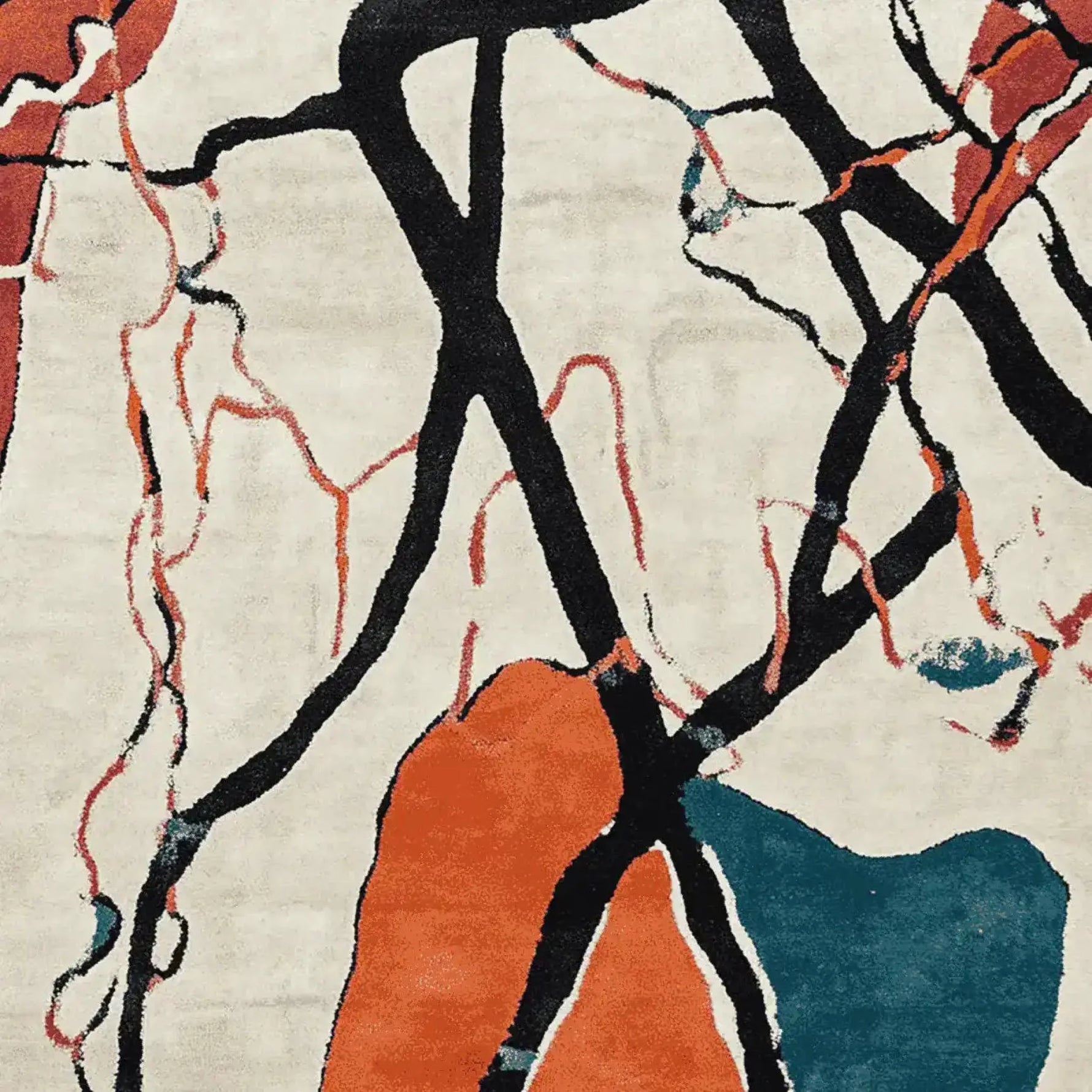 A vibrant area rug featuring an abstract design with bold black lines and splashes of orange and teal, perfect for large living room spaces. This hand-tufted wool rug adds a contemporary flair to any living room area.