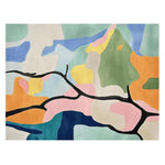 This vibrant area rug features an abstract design with bold, colorful shapes in shades of green, blue, orange, and pink. Perfect as a wool rug for adding a contemporary touch to your living room, this hand-tufted piece showcases a striking black line weaving through the colors, making it an eye-catching centerpiece for any space.