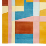 Vibrant area rug featuring a colorblock design with bold, geometric shapes in blue, pink, yellow, and orange tones. This wool rug is perfect for adding a contemporary touch to living room spaces, especially in an 8x10 size. Ideal for those seeking stylish area rugs for their living room.