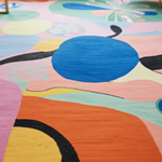 Colorful abstract rug with circular and wavy patterns