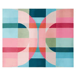 A vibrant and contemporary area rug featuring a geometric abstract design with shades of pink, blue, green, and orange. Perfect for enhancing large living room spaces, this wool rug adds a modern touch to any interior. Ideal for those seeking stylish living room area rugs.