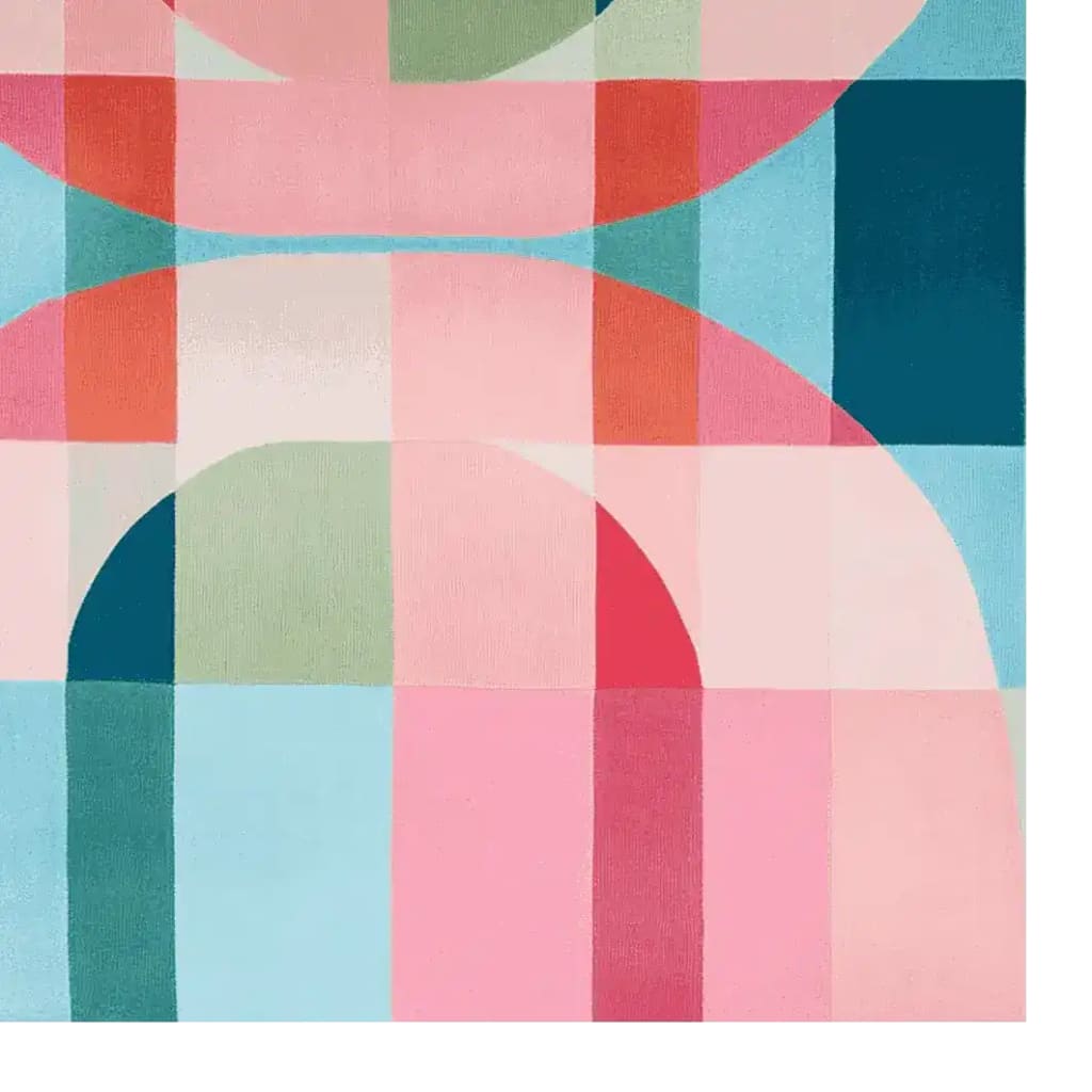 Vibrant and colorful area rug with an abstract geometric pattern, perfect for large living room spaces. This contemporary wool rug showcases a delightful mix of pink, blue, green, and red hues, adding a modern touch to any living room area.