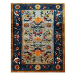 A vibrant and colorful carnival hand-tufted wool rug, perfect as a large area rug for living rooms. This beautiful wool rug features intricate floral and abstract patterns in rich hues of blue, orange, yellow, and red, making it an ideal choice for adding warmth and style to any living room.