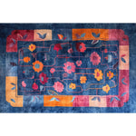 Vibrant hand-tufted wool area rug featuring a colorful floral design. Perfect for adding a touch of elegance to large living rooms or dining rooms. This large area rug combines rich blues, reds, and oranges, ideal for formal dining room settings and enhancing the decor with its unique floral pattern.