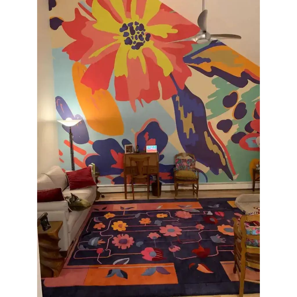 A vibrant living room featuring a Colorful Connects Hand Tufted Rug. This large area rug is perfect for a formal dining room or living room, showcasing a stunning floral design in warm hues. Made from high-quality wool, it's an ideal choice for anyone looking for large area rugs or wool rugs to enhance their space.