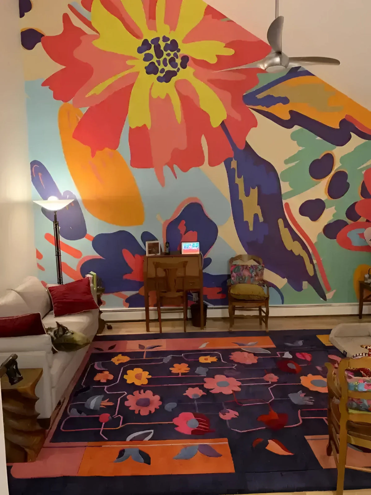 A vibrant living room featuring a Colorful Connects Hand Tufted Rug. This large area rug is perfect for a formal dining room or living room, showcasing a stunning floral design in warm hues. Made from high-quality wool, it's an ideal choice for anyone looking for large area rugs or wool rugs to enhance their space.