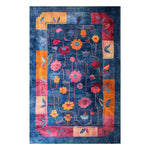 A vibrant, hand-tufted area rug featuring a colorful abstract floral design in shades of red, orange, and pink on a deep blue background. This wool rug is ideal for adding a splash of color to living room and dining room spaces, offering both style and comfort as a dining room carpet or a centerpiece in the living room.