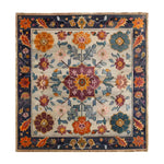 This vibrant hand-knotted area rug features a colorful crest medallion design, perfect for enhancing living room and dining room spaces. The intricate patterns echo the elegance of Persian rugs, making it an ideal wool rug choice for dining room area rugs.