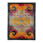 Vibrant and colorful hand-knotted area rug featuring an intricate kaleidoscope pattern with swirling designs in shades of orange, red, and dark blue. The central motif draws attention with its symmetrical floral elements, creating a captivating focal point. Perfect for adding a splash of color and artistry to any room.