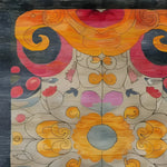 Beautiful hand-knotted area rug featuring a colorful kaleidoscope pattern with vibrant swirls and floral motifs. Perfect for adding a touch of elegance to large living rooms, this contemporary rug combines traditional Persian rug influences with modern design.