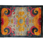 A vibrant and colorful kaleidoscope area rug, featuring intricate patterns inspired by Persian designs. Perfect for large living rooms, this contemporary rug combines swirling shades of orange, red, and purple with floral motifs, creating a stunning focal point.