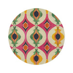 Colorful Retro Geometric Pattern Round Rug with bold ogee shapes in pink, green, orange and yellow on a cream ground, flat overhead view