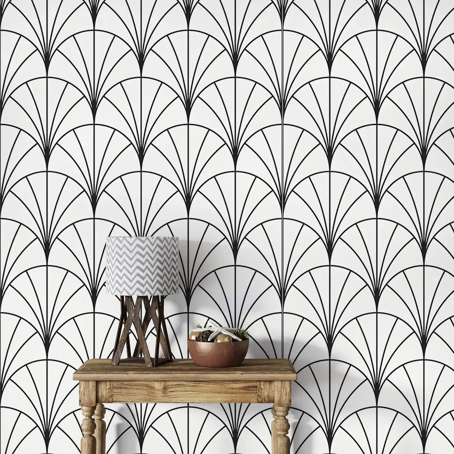 Console with chevron lamp against monochrome round line wallpaper, black-and-white deco fans