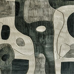 Contemporary charcoal hand tufted area rug showcasing an abstract design with a mix of dark and light tones, perfect for adding sophistication to a bedroom or dining room. This wool rug features a unique pattern that enhances any space, whether used as a dining table rug or as an accent in bedroom rugs.