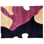 A contemporary area rug with an abstract design, featuring bold shades of pink, beige, and black. This wool rug is perfect for adding a modern touch to living room spaces, particularly in the popular 8x10 size.