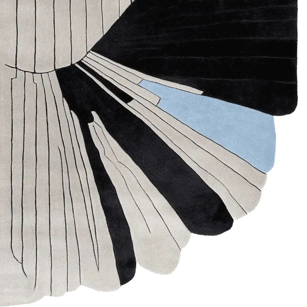 This contemporary wool rug features a striking abstract design with bold black and beige lines, accented by subtle blue tones. Perfect for large living room spaces, this hand-tufted area rug adds a modern touch to any decor.