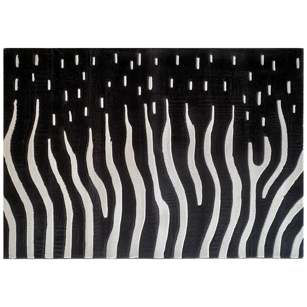 A stylish area rug featuring a black and white abstract design reminiscent of zebra stripes, viewed from above. This hand-tufted wool rug adds a modern artistic touch to any space.