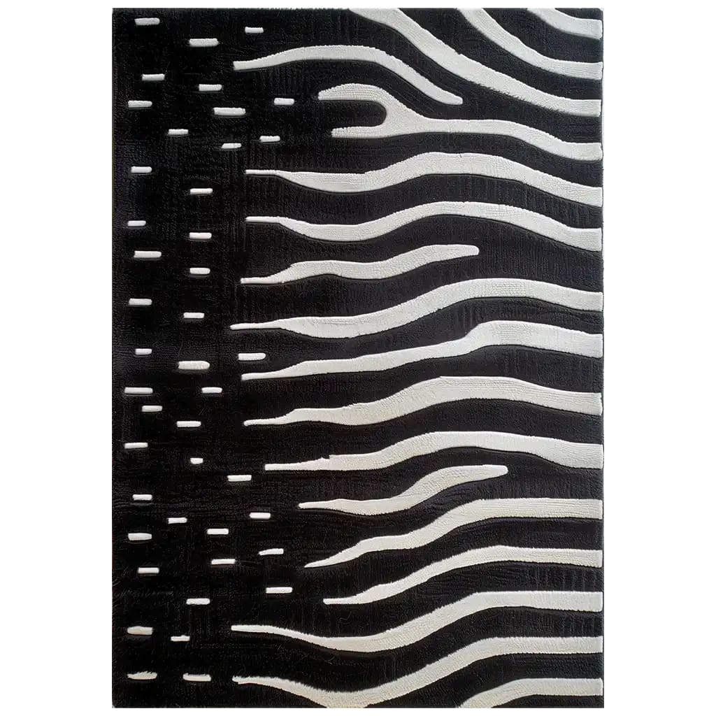 A stylish area rug with a bold black and white abstract pattern, resembling zebra stripes, hand tufted in wool, adding a modern touch to any room.