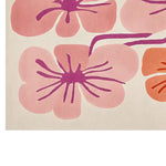 A vibrant area rug featuring a hand-tufted wool design with abstract floral patterns in shades of pink and purple, set against a neutral background.