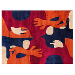 Vibrant Coral Reef Dreamscape hand-tufted wool area rug featuring bold abstract shapes in shades of red, orange, and blue. The intricate pattern adds a touch of artistic flair, ideal for modern home decor.