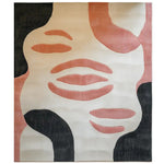 Coral Whisper hand tufted wool area rug featuring an abstract design with coral, black, and cream shapes, displayed in a top view.