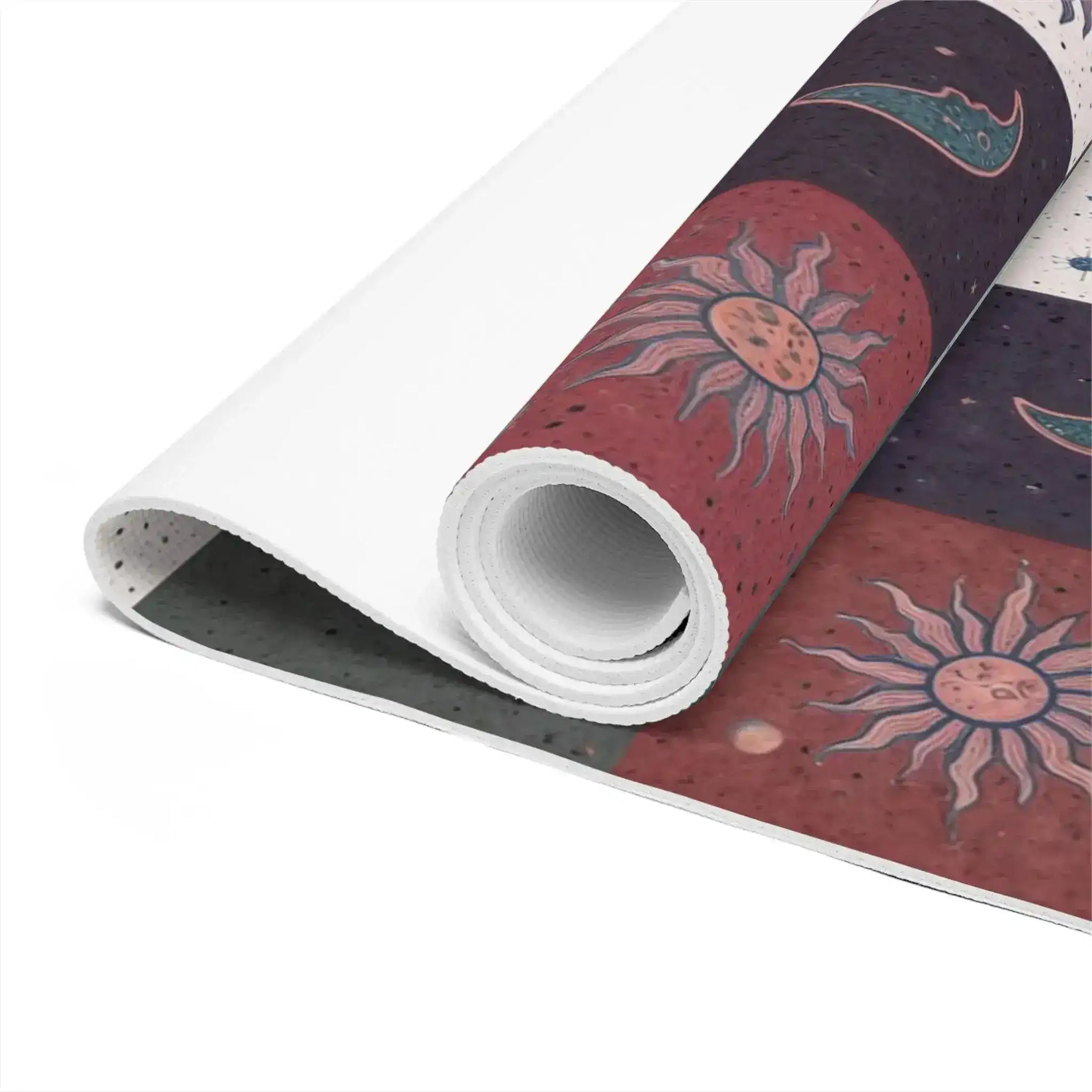 Close-up of rolled Cosmic Balance mat edge, detailed sun motif on rust tile, textured grey underside