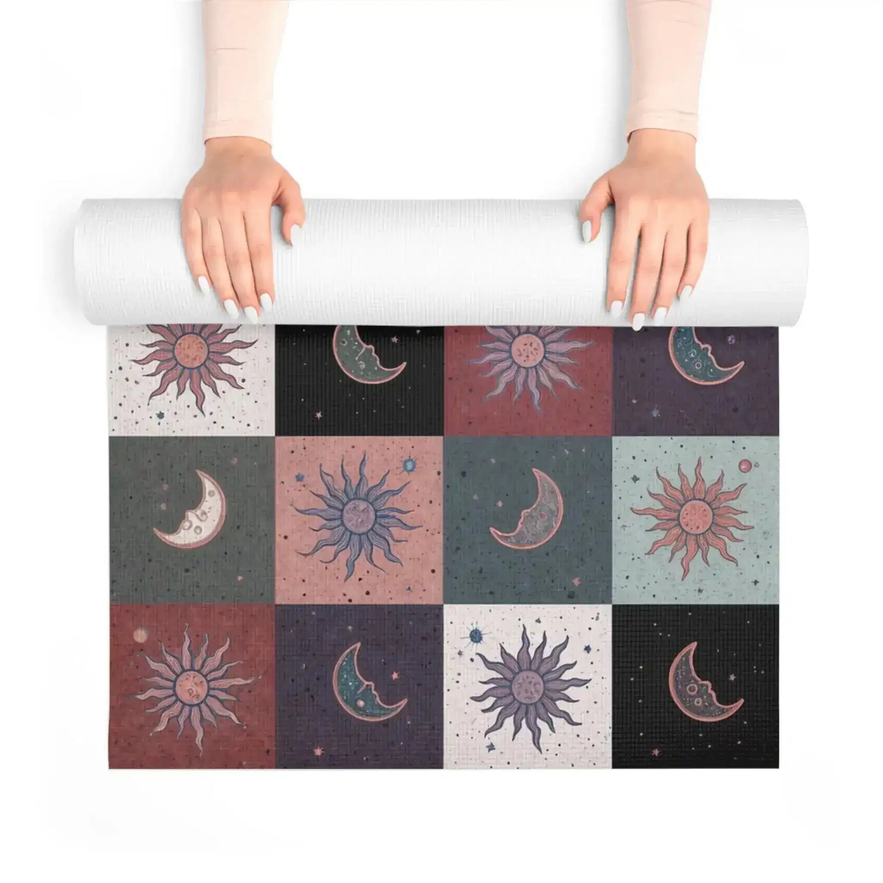 Hands unrolling the Cosmic Balance mat, revealing celestial sun and moon checkerboard tiles
