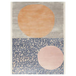 Cosmic Bloom Hand Tufted Wool Area Rug showcasing an abstract design with large peach and pink circles on a textured grey and blue background, creating a modern and stylish look.