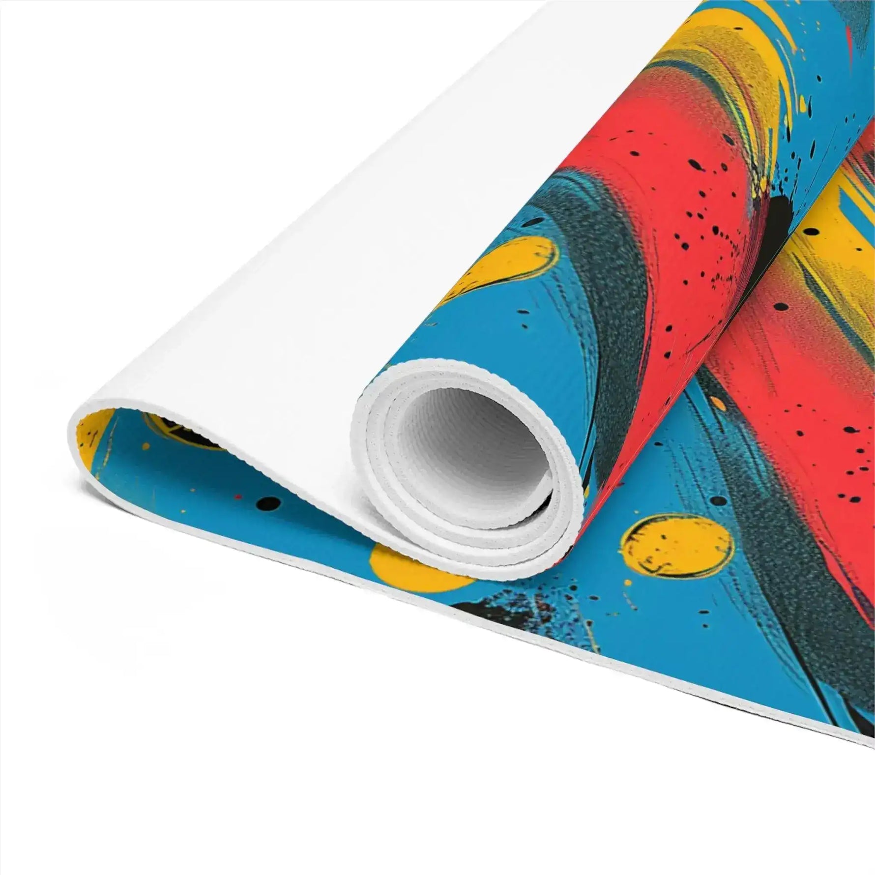 Close-up of rolled Cosmic Energy Flow yoga mat, white core and vivid red-blue brushwork surface